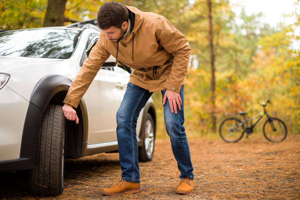 man checking a tyre